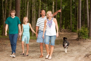 family-walking-dog