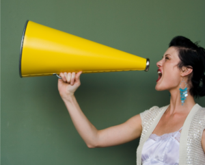 woman-shouting-into-a-megaphone